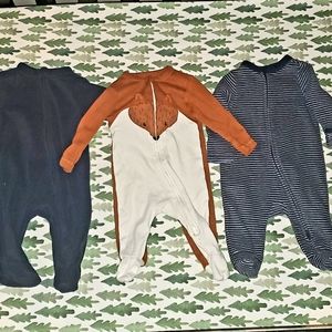 Lot of 0-3 month footed pajamas.